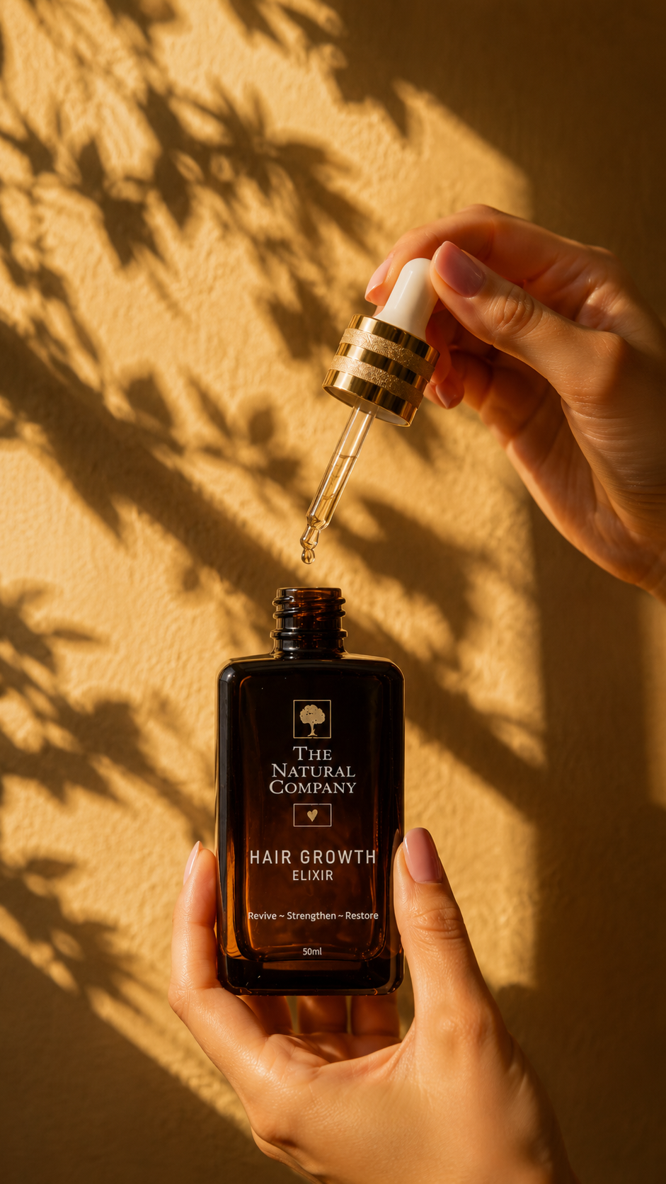 Hair Growth Elixir bottle with dropper in warm sunlight